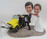Personalized custom wedding cake with car bobbleheads