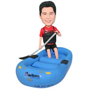 Man in red shirt playing kayaking bobblehead