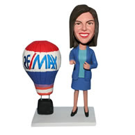 Woman in blue suit with fire balloon bobblehead
