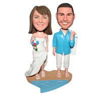 Groom in blue T-shirt and bride in white wedding dress on the beach bobblehead