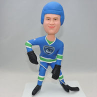 Hockey players bobbleheads in blue uniform and hat
