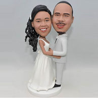 Custom bobbleheads in white dress and grey suit