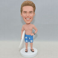 Funny surfing bobblehead with blue shorts 