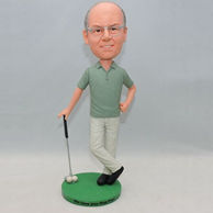Personalized golf player bobblehead with two white ball on the green ground