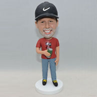 Personalized young man bbobbleehad with black Nike hat