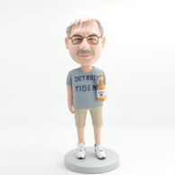 Personalized bobblehead with brown glasses and a drink