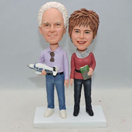 Custom old couple bobbleheads with something holding in hand