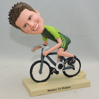 Custom boy bobblehead ride the bicycle with green clothes