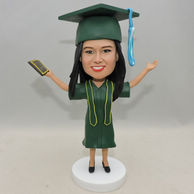 Personalized Girl Bobblehead with green graduation uniform and hat