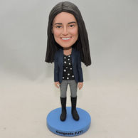 Graduated girl bobblehead with top boot and dark blue jacket