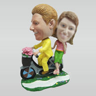 Personalized couple in red car bobbleheads