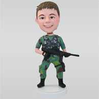 Soldier in jungle fatigues holding a machine gun custom bobbleheads