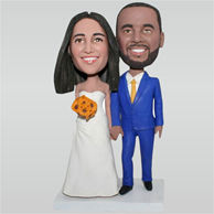 Groom in blue suit and bride in white wedding dress holding a bunch of flowers custom bobbleheads