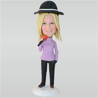 Woman in purple T-shirt holding a microphone custom bobbleheads