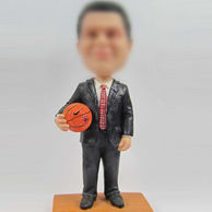 Boss with basketball bobble head doll