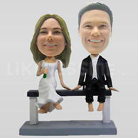Wedding Couple Bobbleheads sitting on a bench-10744