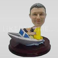 Custom man bobblehead driving a boat