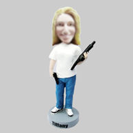 Custom girl and gun bobbleheads