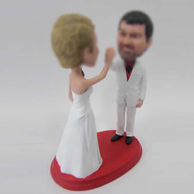 Customized bobbleheads of wedding cake topper