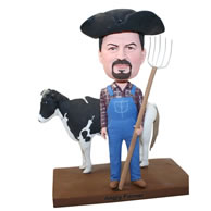 Custom farmer bobblehead with cow bobblehead