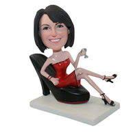 Custom hot girl sitting on a big high-heeled shoe bobbleheads