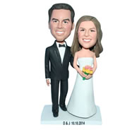 Groom in black suit and bride in white wedding dress handing a bunch of flowers bobblehead