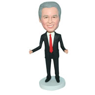 Business man in black suit matching with a red tie bobblehead