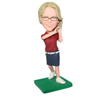 Beautiful woman in red shirt matching with short skirt playing golf bobblehead