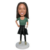 Mordern woman in dress handing with a cup bobblehead