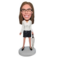 Mordern woman in white coat handing with an umbrella bobblehead