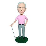 Man in pink shirt playing golf bobblehead