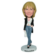 Mordern lady in black coat handing with a bag bobblehead