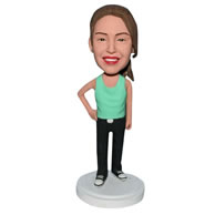 Young girl in green vest bobblehead