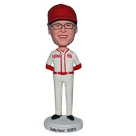 Man bobblehead  in white sports wear matching with a red cap
