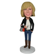 Slim woman in black coat handing a bag custom bobblehead