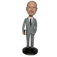Man in grey suit handing with a book custom bobblehead