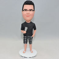 Custom bobbleheads in black shirt and black plaid shorts