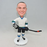 Hockey players custom bobbleheads with a stick