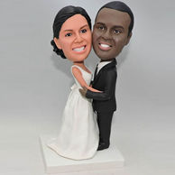 Custom bobbleheads in black suit and white dress