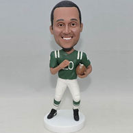 Soccer bobbleheads in green jersey