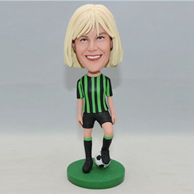 Football player bobbleheads for her in grreen jersey