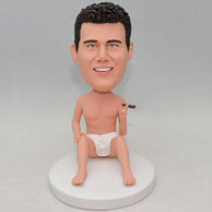 A man bobblehead holding a cigar