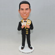 A black suit man bobblehead with play cards