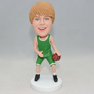 Young basketball palyer bobblehad with green jersey