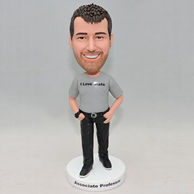 A man bobblehead with grey shirt and a black watch