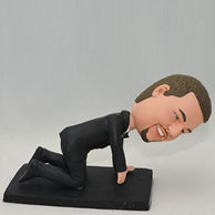 Funny man bobblehead Kneeling on the ground with black outfit