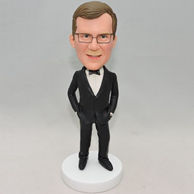 Hand in pocket boss bobblehead with black suit