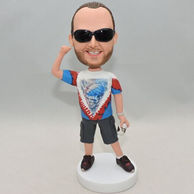 Personalized bobble head dolls with dark grey shorts and black sunglasses