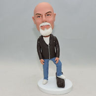 Personalized man woodcutter bobblehead with left foot on the wood
