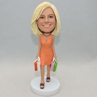 Personalized young girl bobblehead with many shopping bag